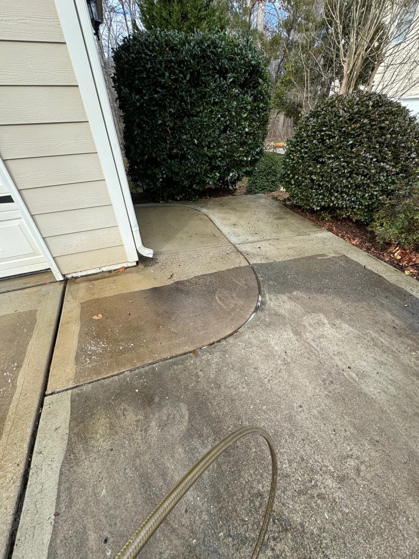 Driveway pressure wash – black streaks gone