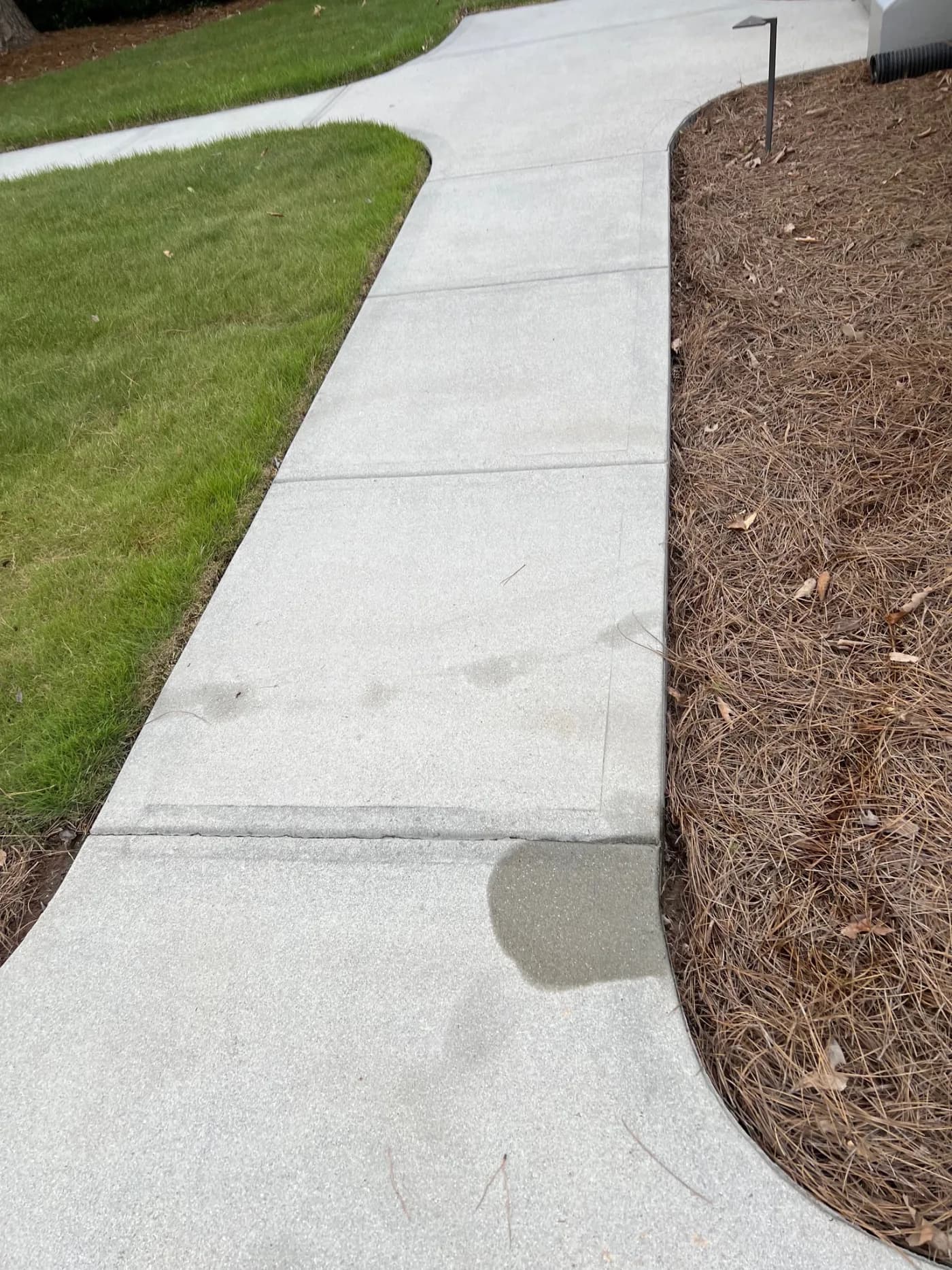 Driveway pressure wash – black streaks gone